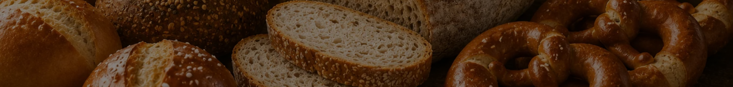 A panoramic spread of German breads and pretzels